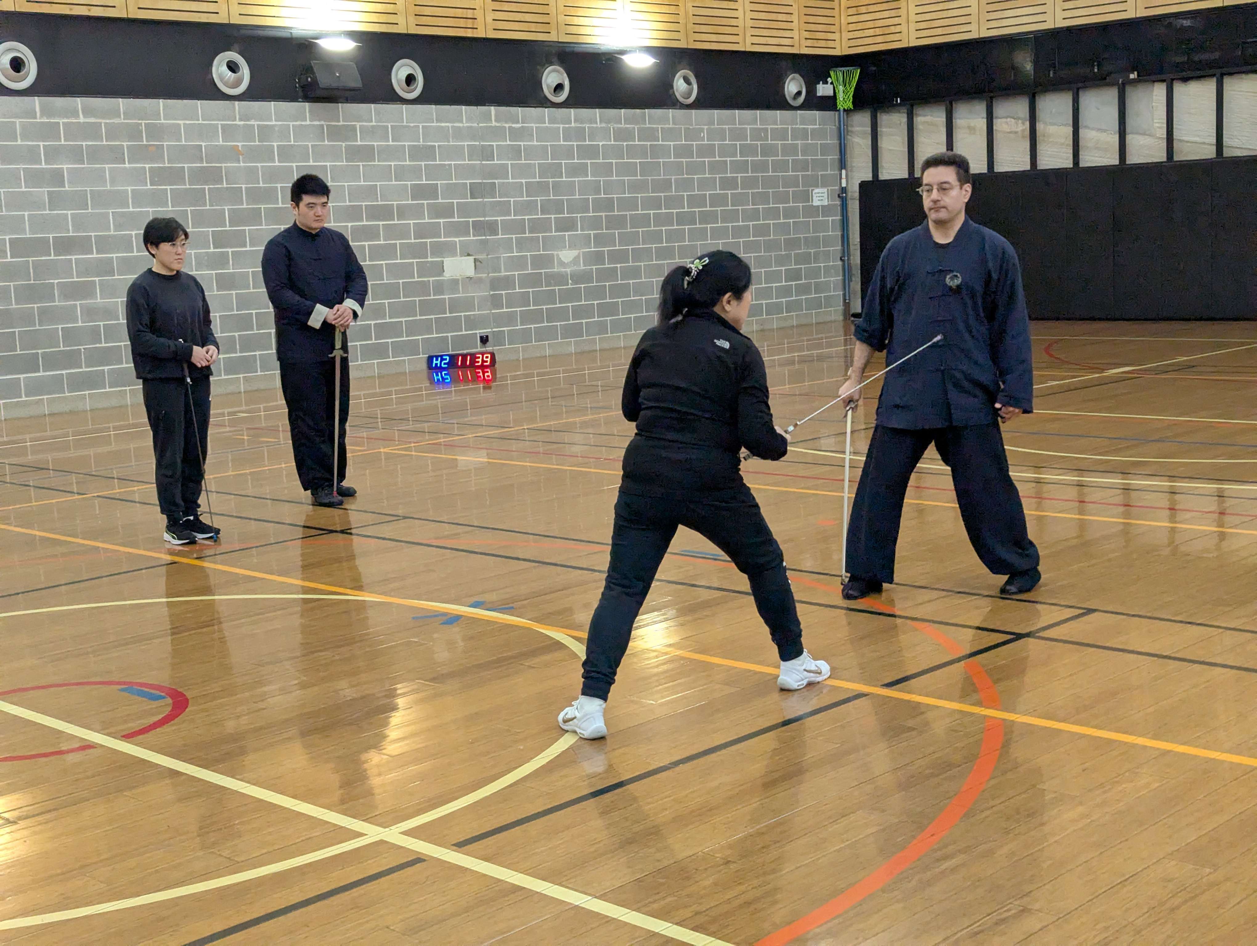 Dr. Lu demonstrating sword approaches